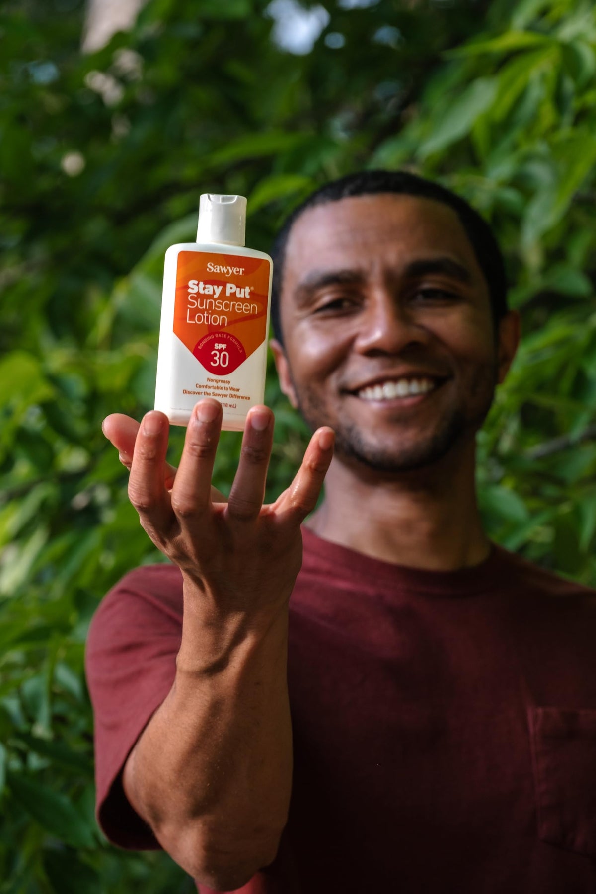 Sawyer sunscreen used at beach illustrating durable outdoor protection benefit