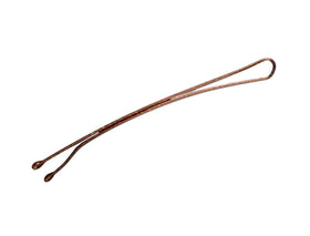 Scunci curved bobby pins securing a sleek bun for longer-lasting polished styles