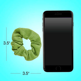scunci scrunchie beside a coin showing scale and realistic size