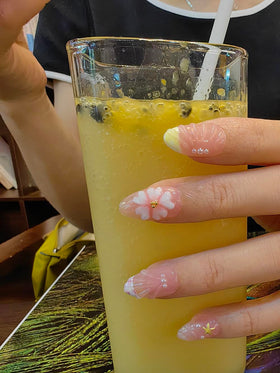 Seafish nails worn in a beach scene conveying seaside style and summer vibe