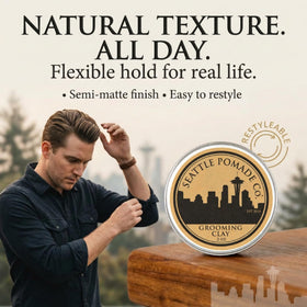 Seattle Pomade Co. clay on fingers demonstrating easy warming and application benefit