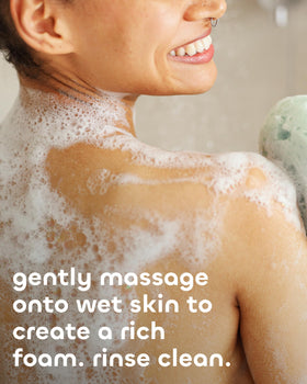 Seaweed Bath Co. lathered on hand in shower showing invigorating cleanse and softening effect