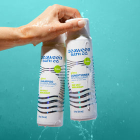 Seaweed Bath Co bottle in hand for size comparison and travel convenience