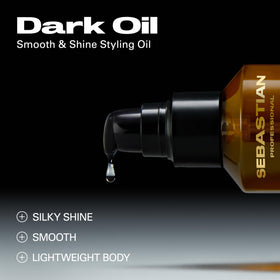 Sebastian Dark Oil texture drop on fingertips showing lightweight absorption benefit