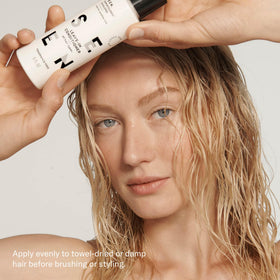 SEEN applied to wet hair while combing to demonstrate detangling and smoothing effect