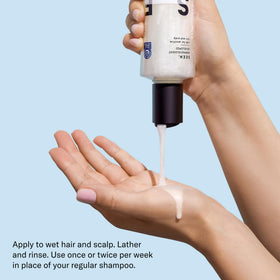 SEEN bottle held in hand to show size and travel-friendly convenience