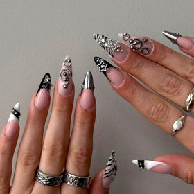 SEENEEY front view of black almond nails with silver rhinestones showing polished finish