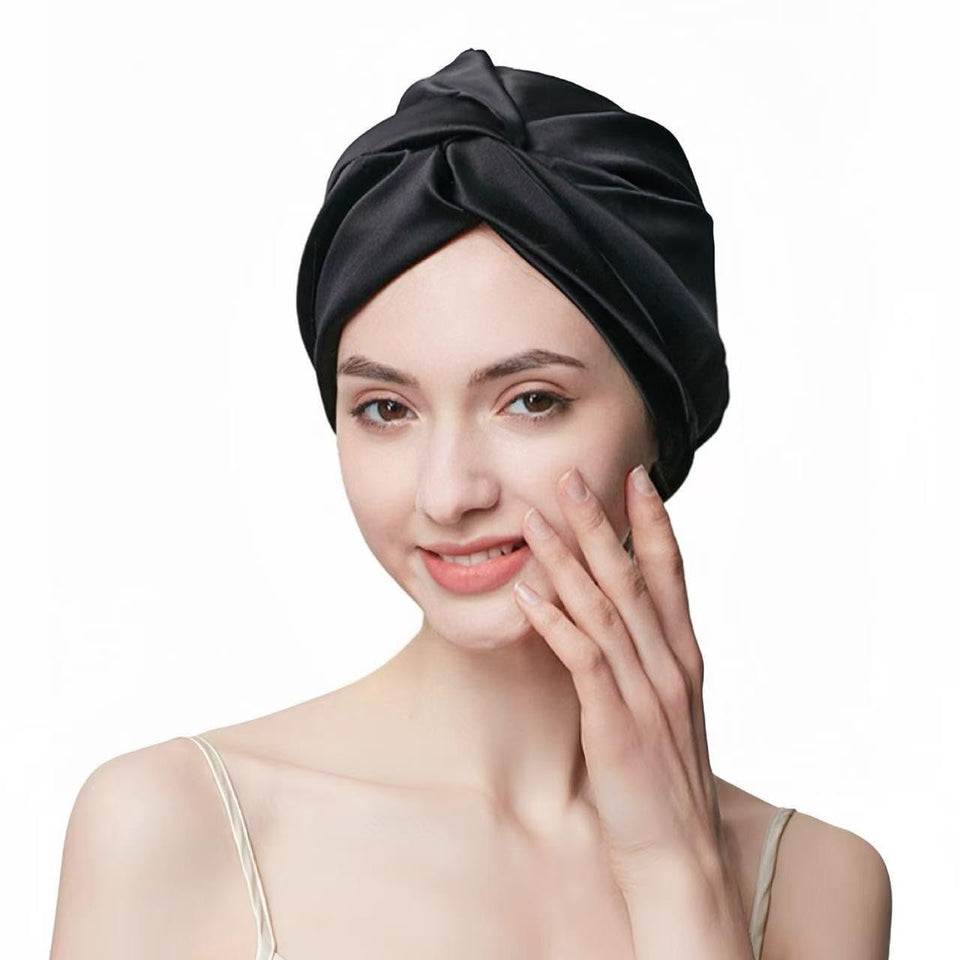 SereLune bonnet front view showing sleek black silk and secure fit benefit sleep protection