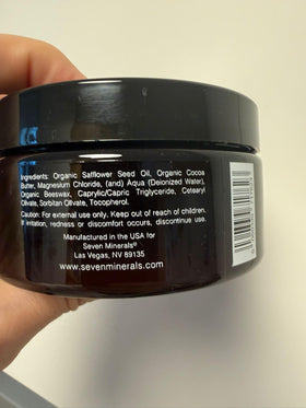 Seven Minerals applying cream on arm demonstrating fast absorption benefit