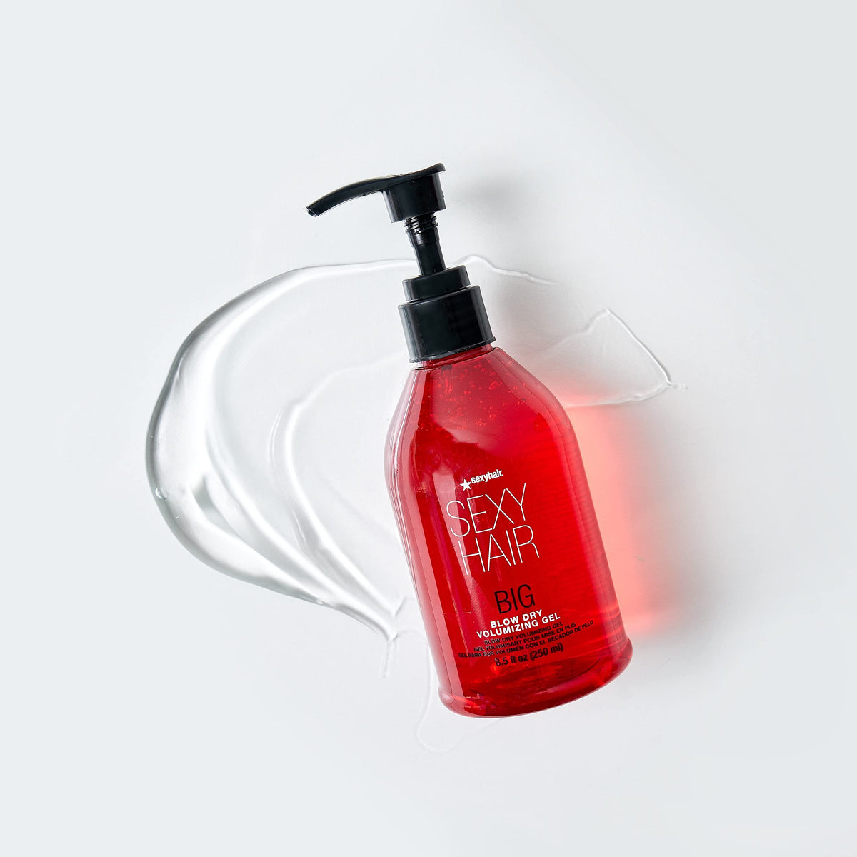 SexyHair bottle held in hand to show 8.5 oz scale and travel-friendly size