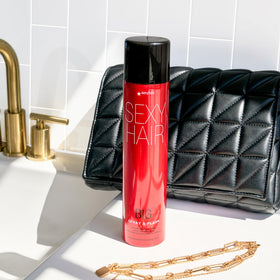 SexyHair used in lifestyle shot showing voluminous, shiny hair benefit