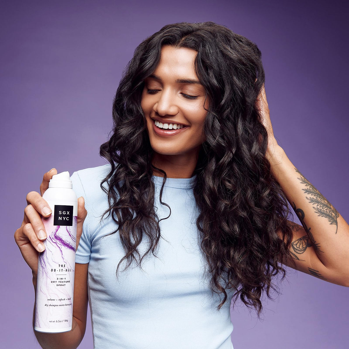 SGX NYC bottle in hand to show size and easy portability benefit