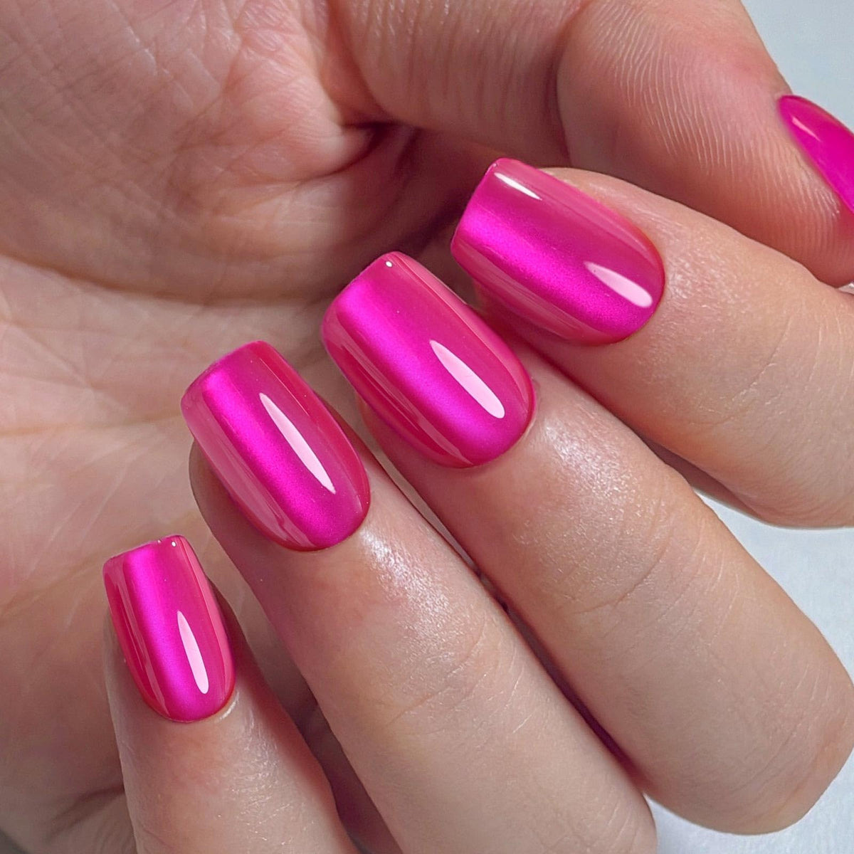 SHANGMENG hot pink nails in a party setting showing bold color impact