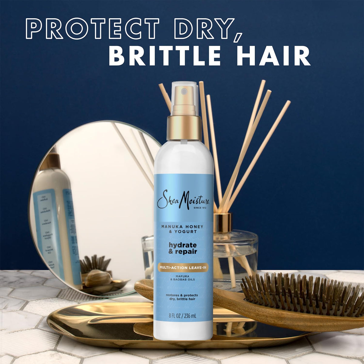 Shea Moisture being sprayed onto damp hair for detangling and prep