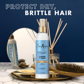 Shea Moisture being sprayed onto damp hair for detangling and prep