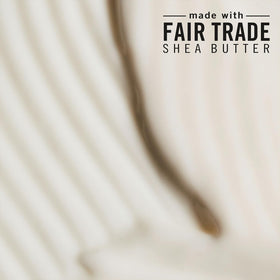 Shea Moisture bottles held in hand illustrating 24 oz scale and value