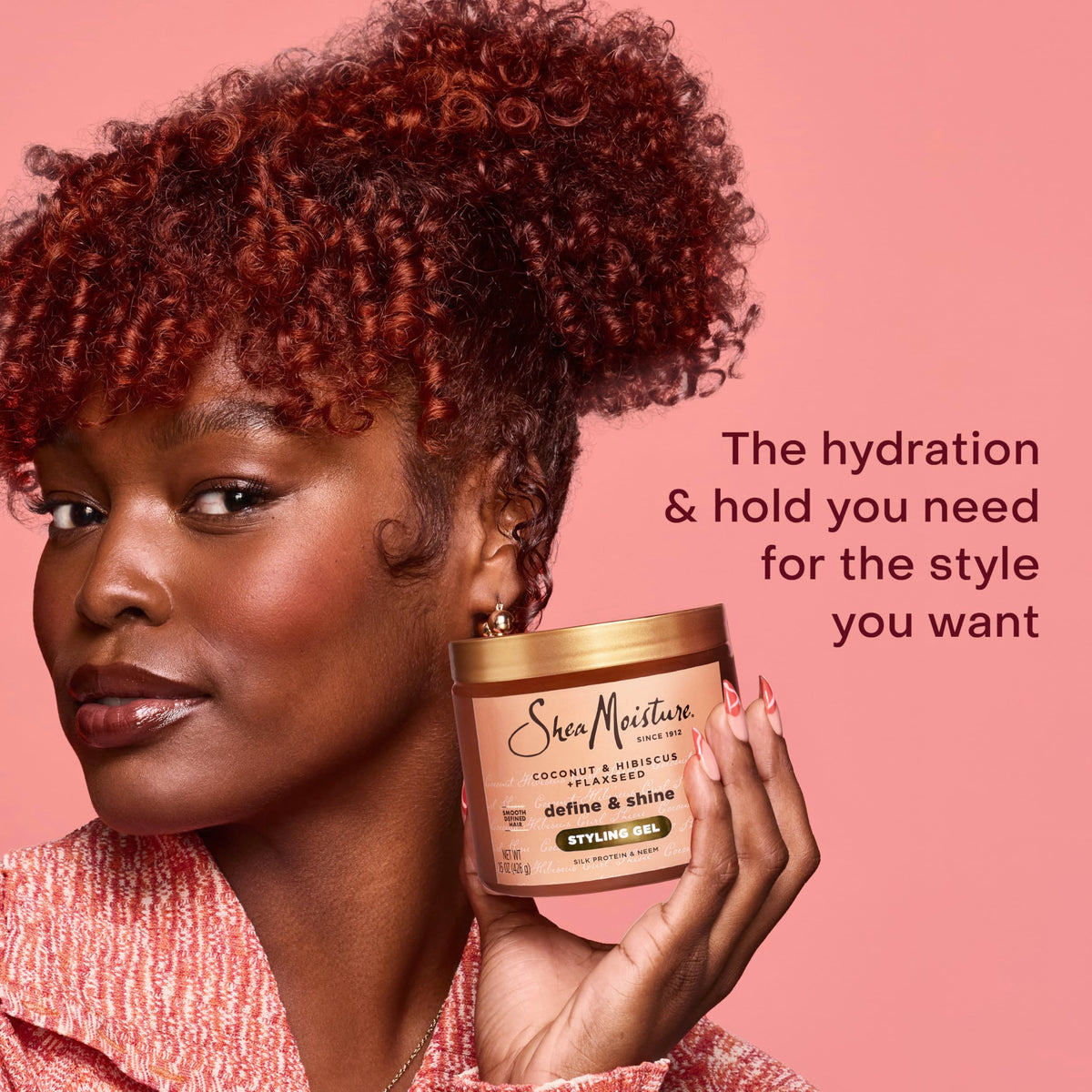 SheaMoisture being applied to curly hair for defined, hydrated curl formation and frizz control