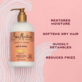 SheaMoisture conditioner being applied in hands, demonstrating moisturize and detangle benefit