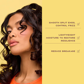 Shea Moisture applying leave-in to damp curls for easier detangling