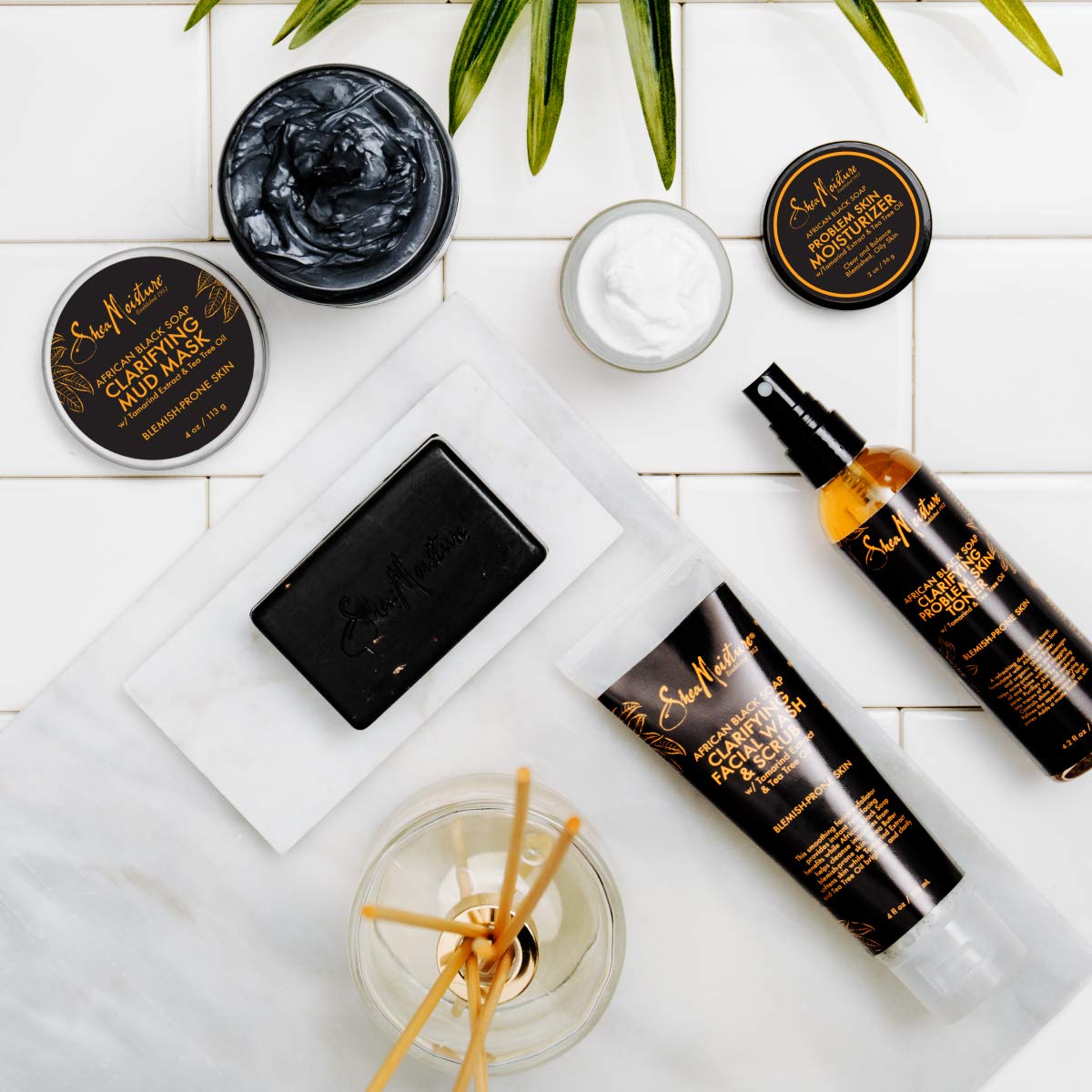 Shea Moisture bottle on bathroom shelf lifestyle showing daily routine fit