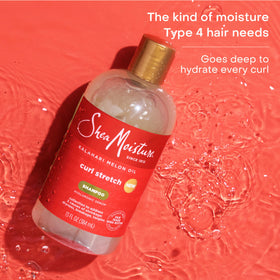 SheaMoisture bottle in hand showing 13 fl oz size reference
