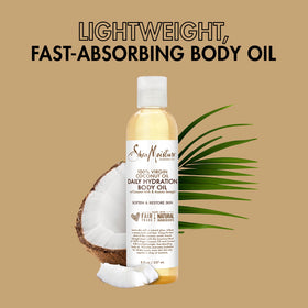 Shea Moisture body oil poured into palm demonstrating simple application and coverage
