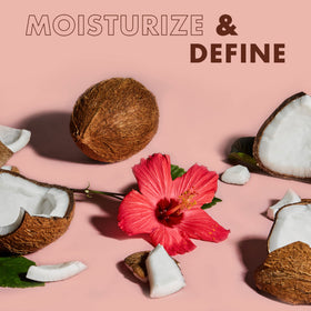 SheaMoisture coconut and hibiscus ingredients arranged to show natural sources