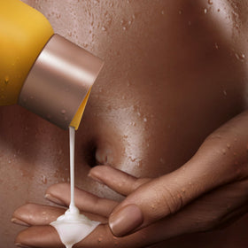 SheaMoisture lather on hands in shower demonstrating gentle cleansing