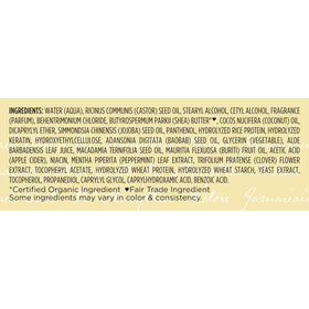 Shea Moisture on curly-haired model outdoors showing hydrated shine
