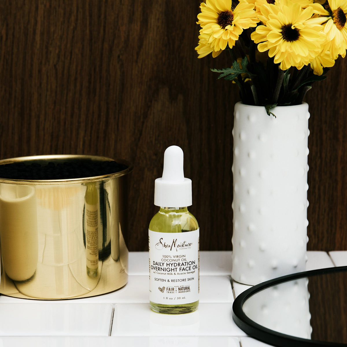 SheaMoisture oil texture on pipette demonstrating lightweight absorbency for smooth skin