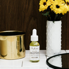 SheaMoisture oil texture on pipette demonstrating lightweight absorbency for smooth skin