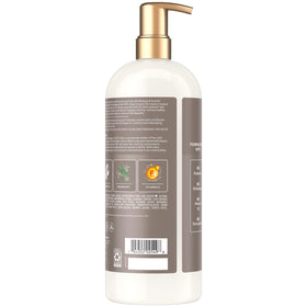 SheaMoisture pump dispensing conditioner demonstrating convenient family-size use