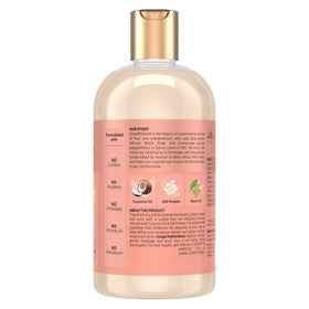 SheaMoisture pump lather on hand demonstrating creamy cleansing benefit