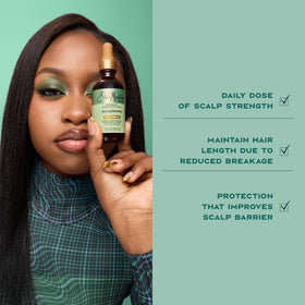 SheaMoisture model massaging oil into scalp for refreshed comfort