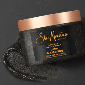 SheaMoisture scrub in use in shower demonstrating exfoliation and soothing action
