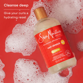 SheaMoisture shampoo applied to wet Type 4 curls for easier detangling