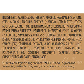SheaMoisture 13 oz bottle in hand for scale and travel-friendly size