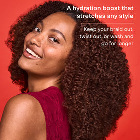 SheaMoisture spray refreshing a twist-out to boost definition