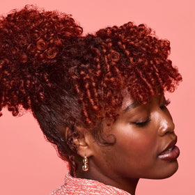 SheaMoisture styled curls in natural light demonstrating shine and long-lasting definition