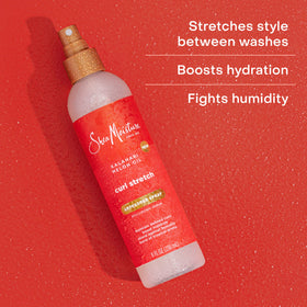 SheaMoisture droplet on hair strand illustrating hydrating texture