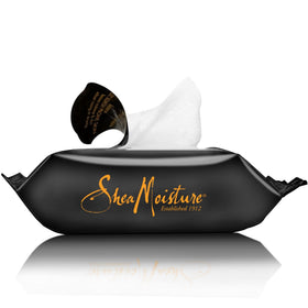 Hand holding SheaMoisture wipe, demonstrating effective makeup removal on the go