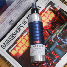 Shear Revival Amity bottle in hand to show size and travel-friendly convenience