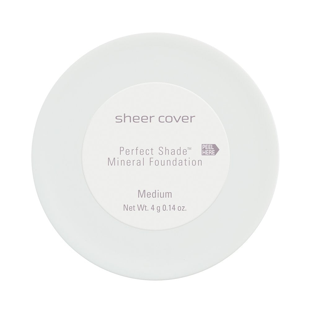 Sheer Cover brush applying powder demonstrating buildable coverage and natural finish