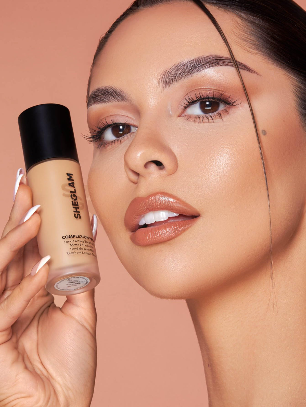 SHEGLAM foundation applied with brush demonstrating even application benefit