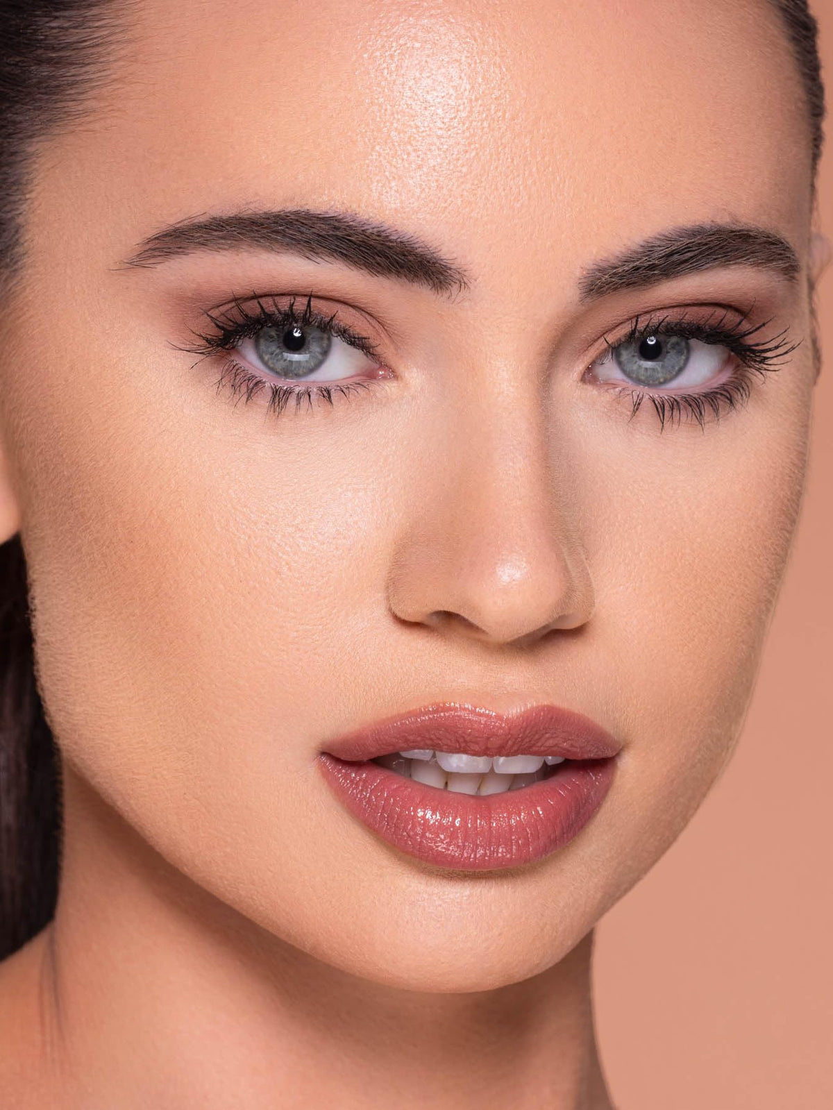 SHEGLAM being applied with sponge for even buildable coverage