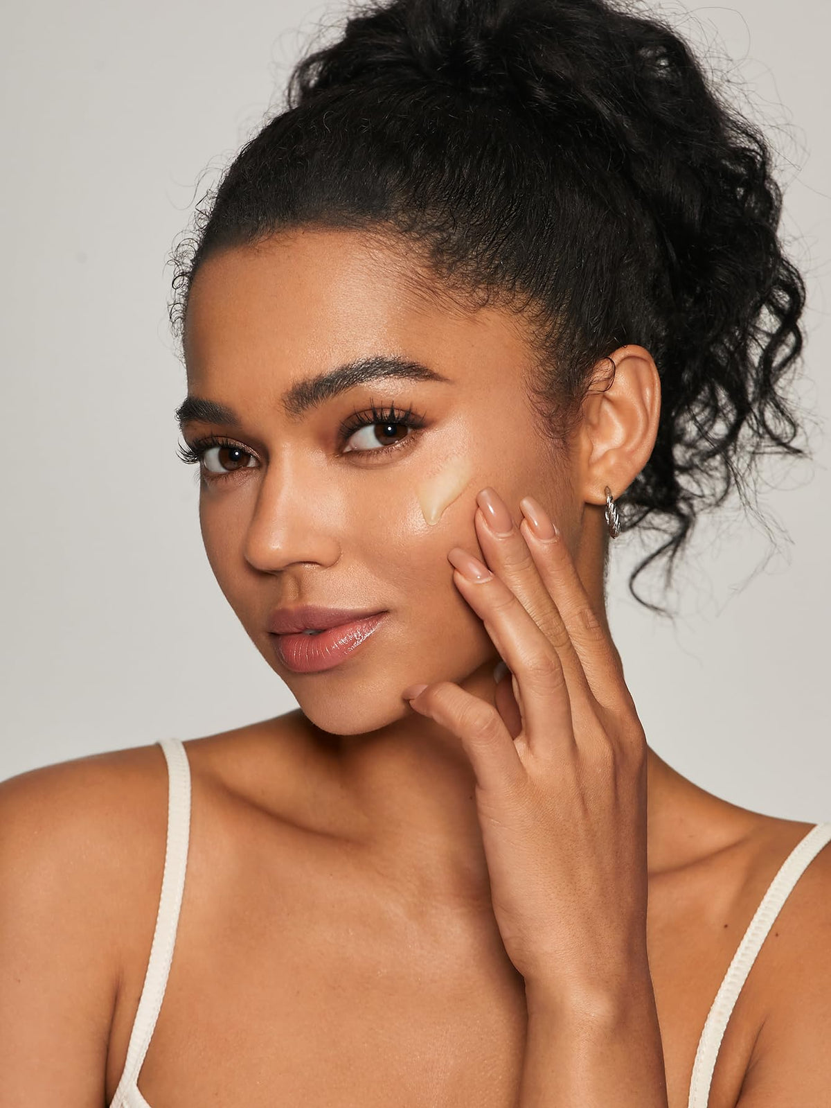SHEGLAM primer on bathroom counter in lifestyle setting suggesting daily routine use