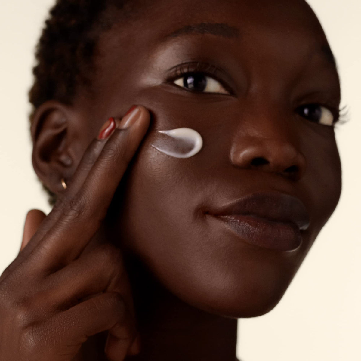 Shiseido Benefiance cream on hand demonstrating absorbent texture benefit for quick comfort