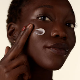 Shiseido Benefiance cream on hand demonstrating absorbent texture benefit for quick comfort