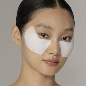 Shiseido eye mask in use on model demonstrating a lifted look