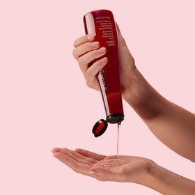 shu uemura art of hair bottle styled on bathroom shelf for daily routine